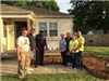 Officer and Residents Pose with Plaque