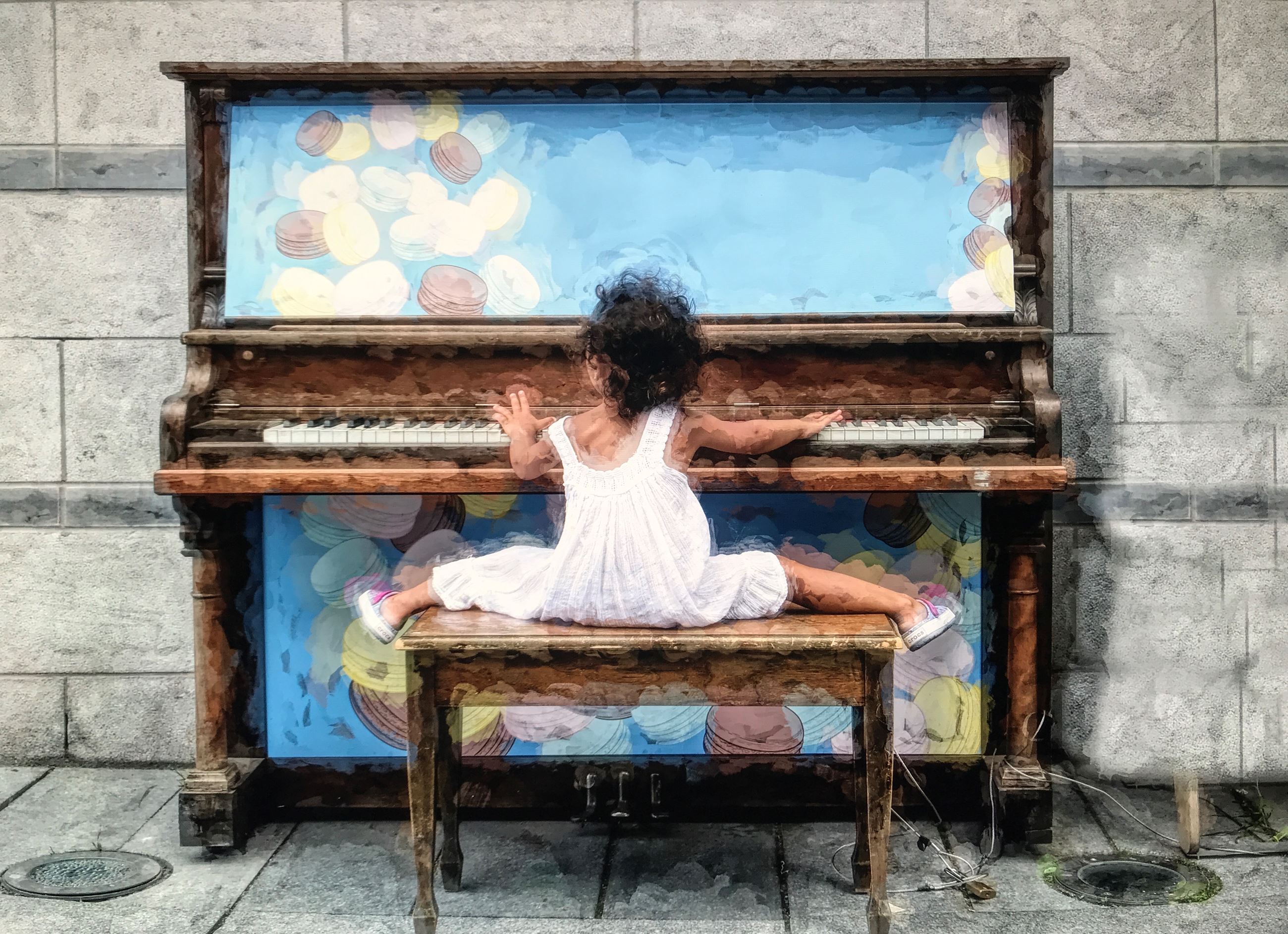 Digital photograph of a young girl playing a piano.