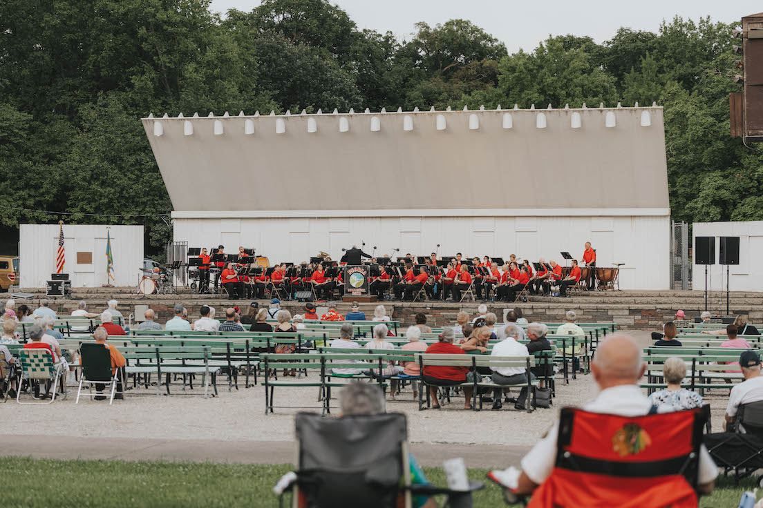 The Peoria Municipal Band performing for a crowd.